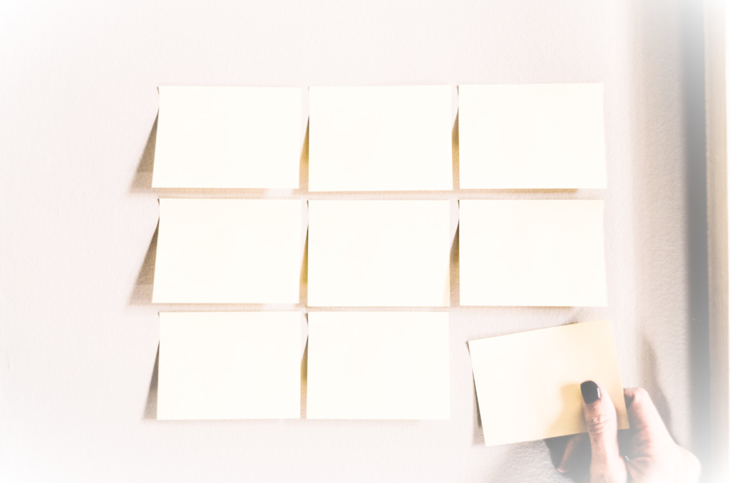 Photo of a grid layout of sticky-backed notecards.